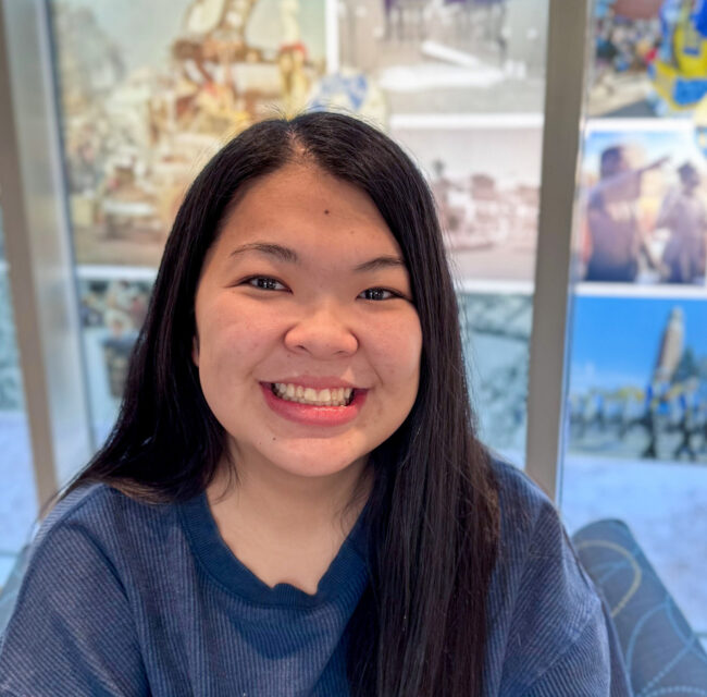 Photo of Hailey smiling in the SDSU Alumni Center