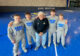 Clay Carlson, Daniel Kimball, Kurtenbach, Cade DeVos, and Tanner Jordan post for photo on the mats in the new Kurtenbach Family Wrestling Center