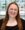 Headshot of Allison Fesler smiling at the camera with a blurred background.