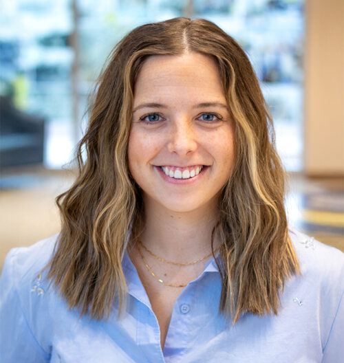Professional headshot of Allison Dahl with a blurred background