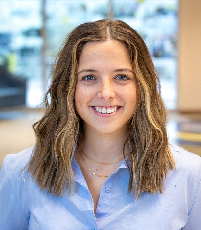 Professional headshot of Allison Dahl with a blurred background