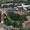 Aerial photo of a SDSU airplane flying over campus, with the Campanile in the distance.