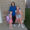 Brandi Haraldson smiles standing in between her two daughters