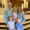Erin Glidden and her husband Tyler smile with their three kids