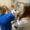 SDSU professor guiding a female nursing student through a procedure with a mannequin patient.