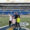 Rachel and her family stand on the 50 yard line of the Dana J Dykhouse Stadium at South Dakota State University