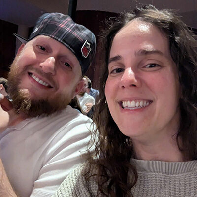 Brandi Haraldson and her husband smile for a photo