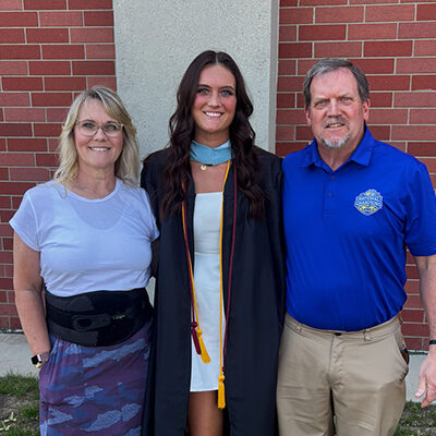 Gracie Barber and her parents at her masters graduation ceremony