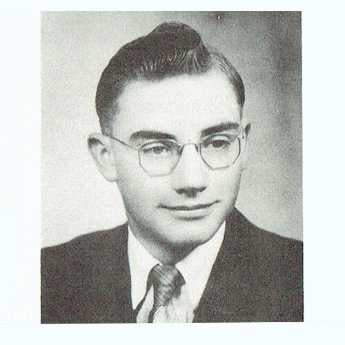 Black and white headshot photo of Maynard Klingbeil smiling during his school years.