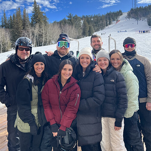 Tom Nieman and his family smile at Terry Peak Ski Lodge.