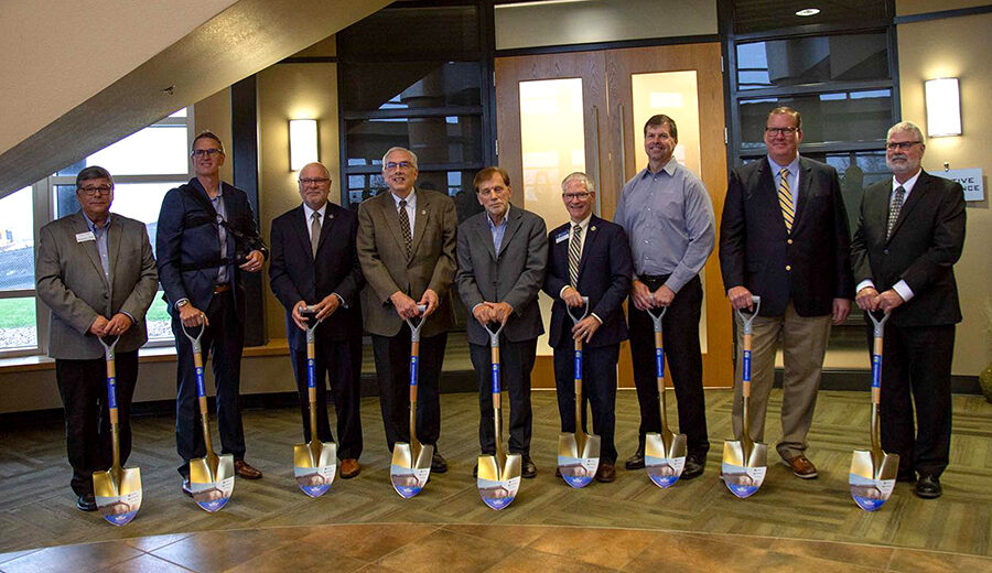 Group photo of people with shovels in their hands, taken at the groundbreaking of the POET Bioprocessing Institute. L to R: Dwaine Chapel, Jeff Lautt, Jim Rankin, Barry Dunn, David Salem, Daniel Scholl, Kevin Tetzlaff, Jeff Partridge, Ralph Davis