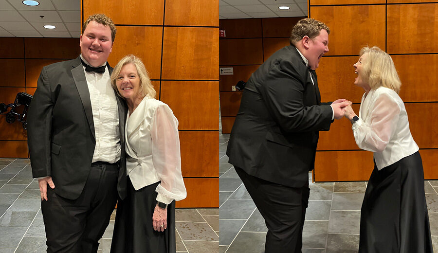 Steiger Manson and Dr. Laura Diddle smile and celebrate after a standing ovation performance by the concert choir and solosit Steiger during Yuletide.